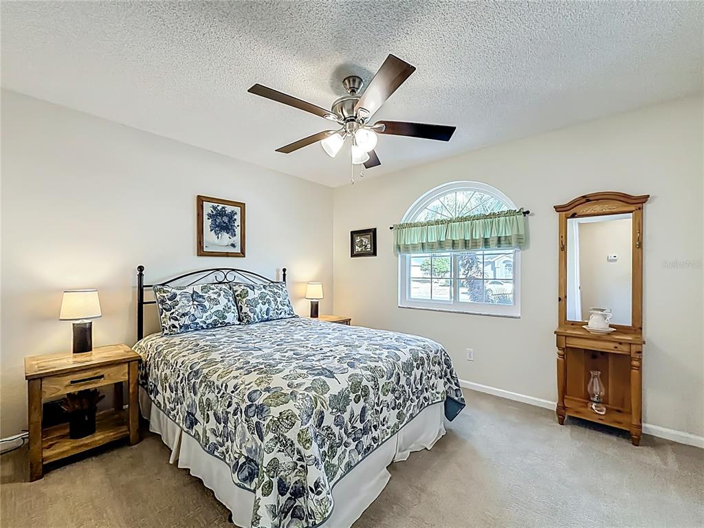 5226 Northwest 21st Loop Ocala, FL 34482 - Photo 24 of 57 a bedroom with a bed and a window