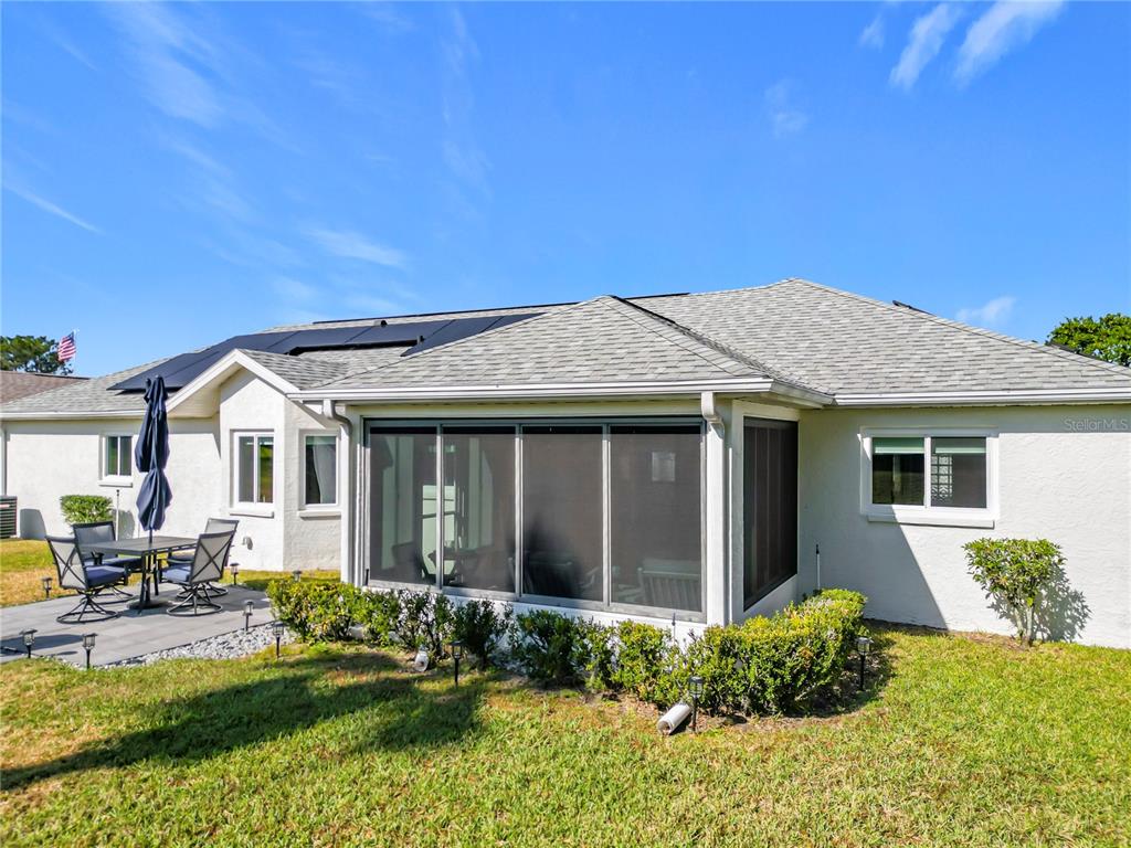 5226 Northwest 21st Loop Ocala, FL 34482 - Photo 35 of 57 a front view of a house with a yard