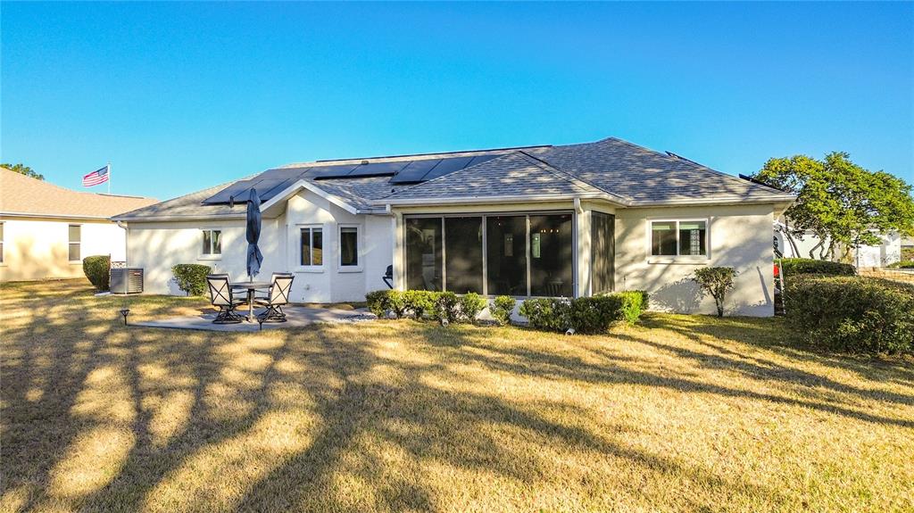 5226 Northwest 21st Loop Ocala, FL 34482 - Photo 39 of 57 a view of a house with backyard sitting area and porch
