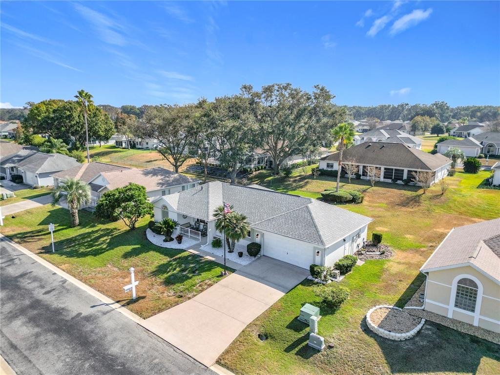 5226 Northwest 21st Loop Ocala, FL 34482 - Photo 43 of 57 an aerial view of a house with swimming pool and a yard