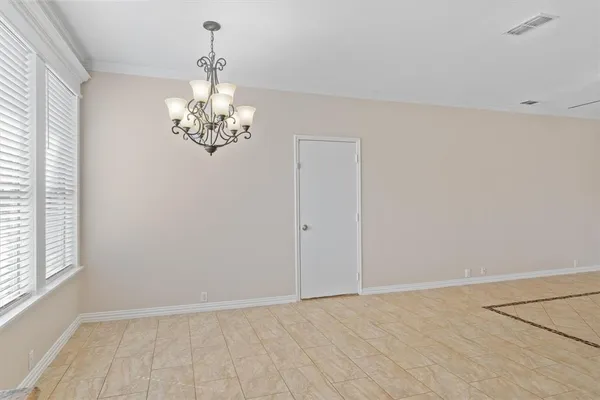 a kitchen with granite countertop a stove top oven and cabinets