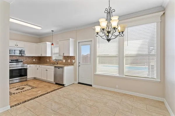 a kitchen with a sink stove and microwave