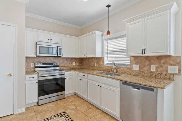 a bed room with a bed and a chandelier