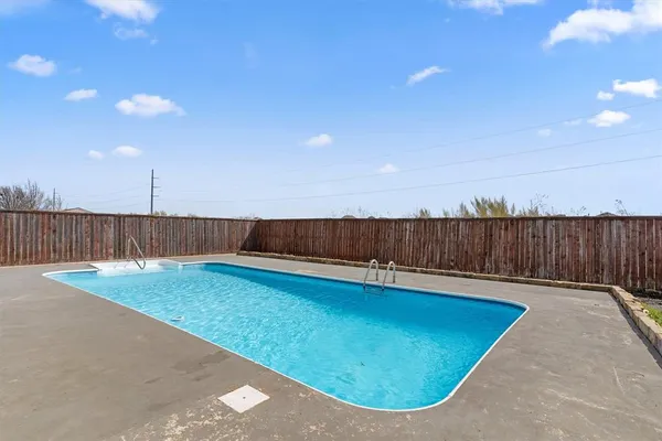 a view of a house with swimming pool