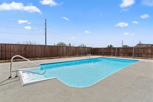 an aerial view of a house with swimming pool