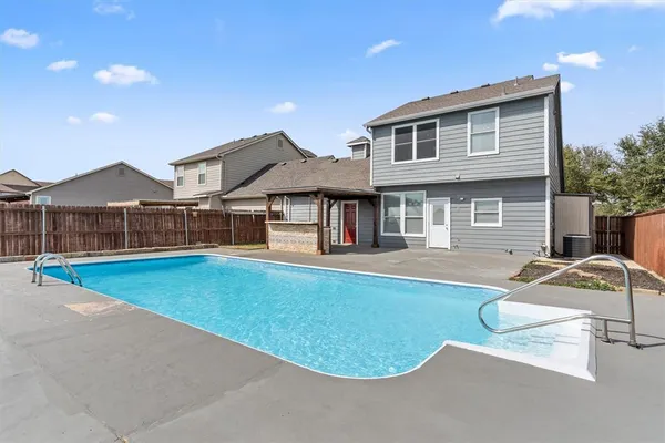 a kitchen with cabinets stainless steel appliances and a sink