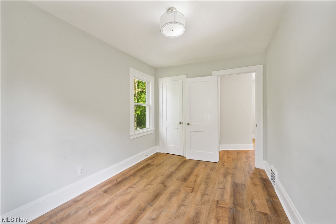 1606 Maple Road Cleveland Heights, OH 44121 - Photo 22 of 30 The 2nd floor offers 3 spacious bedrooms and newly updated full bathroom(2023) features bathtub, sliding shower doors, double sink vanity.