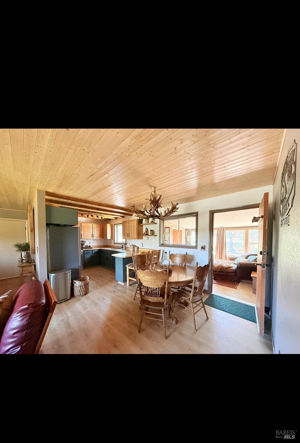 3004 Pencil Road Alturas, CA 96101 - Photo 15 of 40 a view of a dining room with furniture and a chandelier