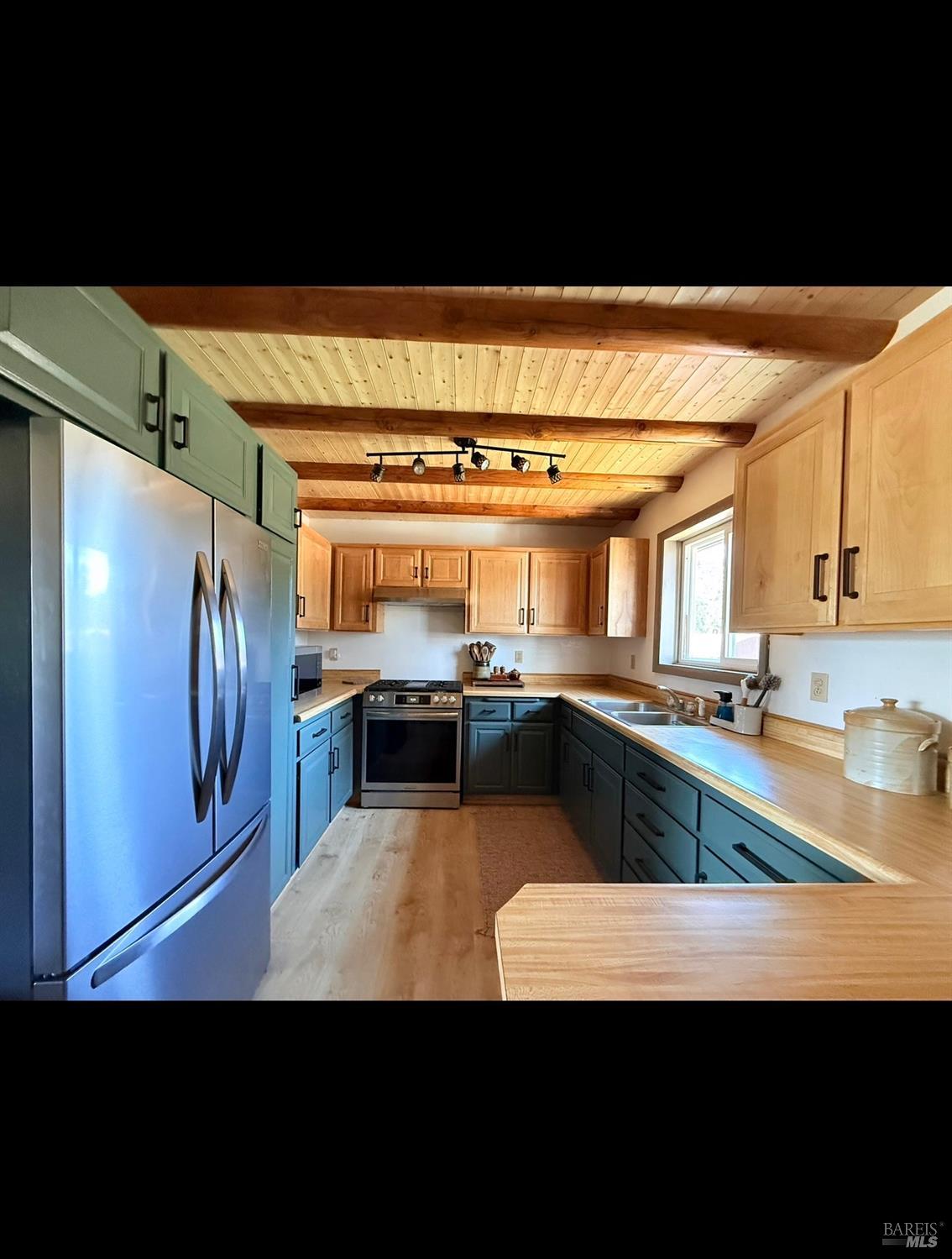 3004 Pencil Road Alturas, CA 96101 - Photo 17 of 40 a view of a kitchen with a sink and dishwasher a stove