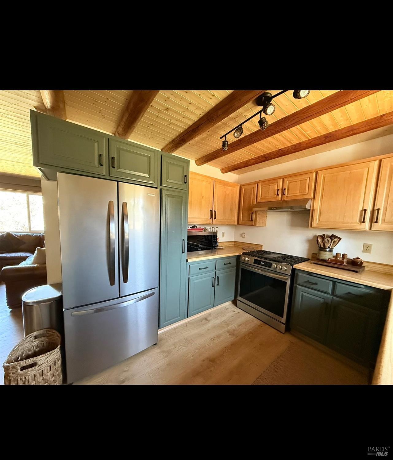 3004 Pencil Road Alturas, CA 96101 - Photo 18 of 40 a kitchen with stainless steel appliances kitchen island granite countertop a refrigerator and a stove