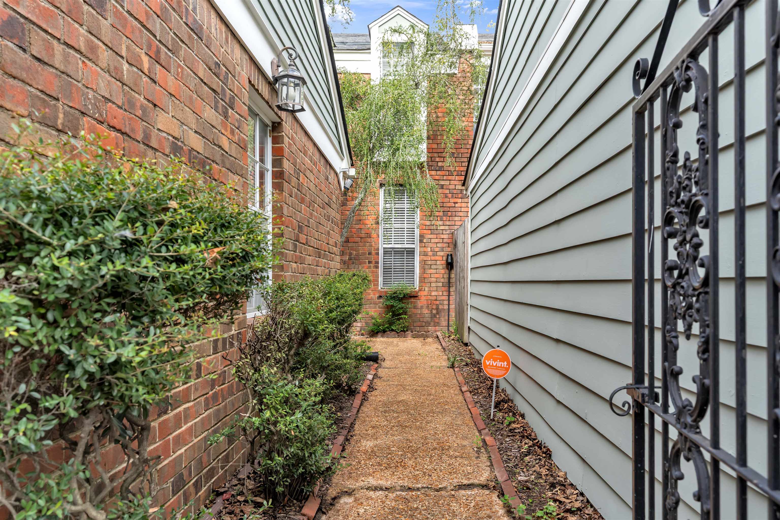 6942 Amberly Road, Unit 6942 Memphis, TN 38119 - Photo 2 of 32 a view of a pathway both side of house