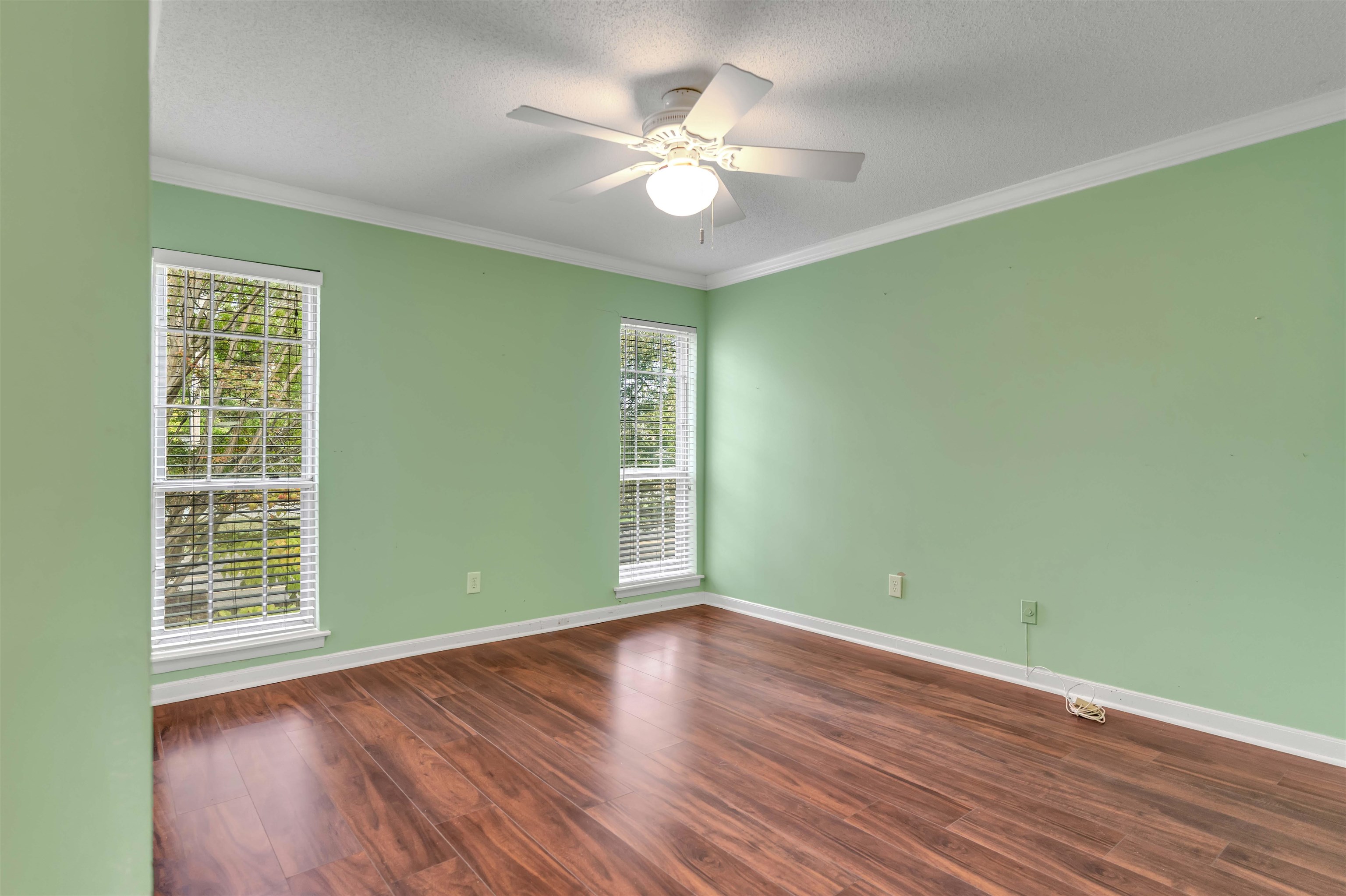 6942 Amberly Road, Unit 6942 Memphis, TN 38119 - Photo 22 of 32 wooden floor in an empty room with a window