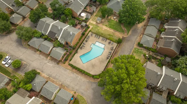 an aerial view of a house with outdoor space and street view