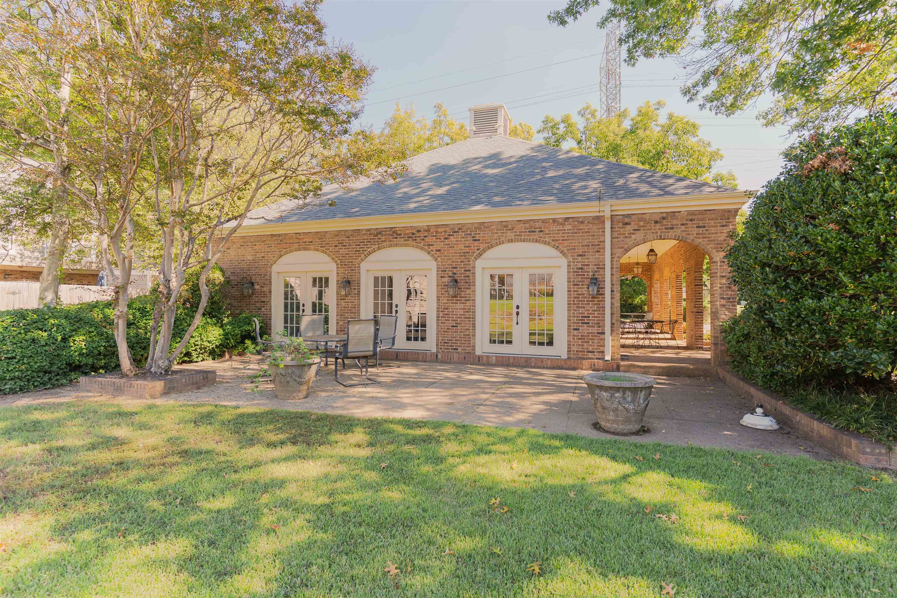 6942 Amberly Road, Unit 6942 Memphis, TN 38119 - Photo 32 of 32 a view of house with backyard and garden