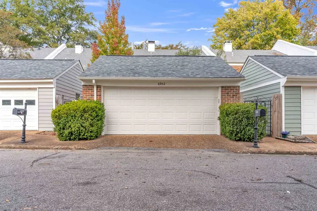 a view of a house with a garage