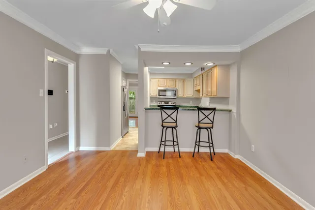 a view of a kitchen with a table and chairs