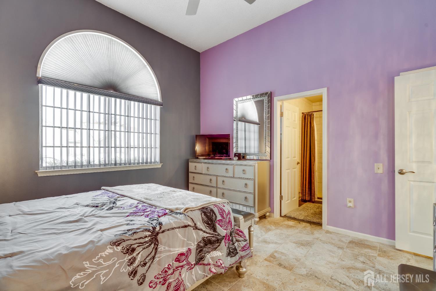 845 B Taylor Road Monroe Township, NJ 08831 - Photo 12 of 15 a bedroom with a bed and a flat screen tv