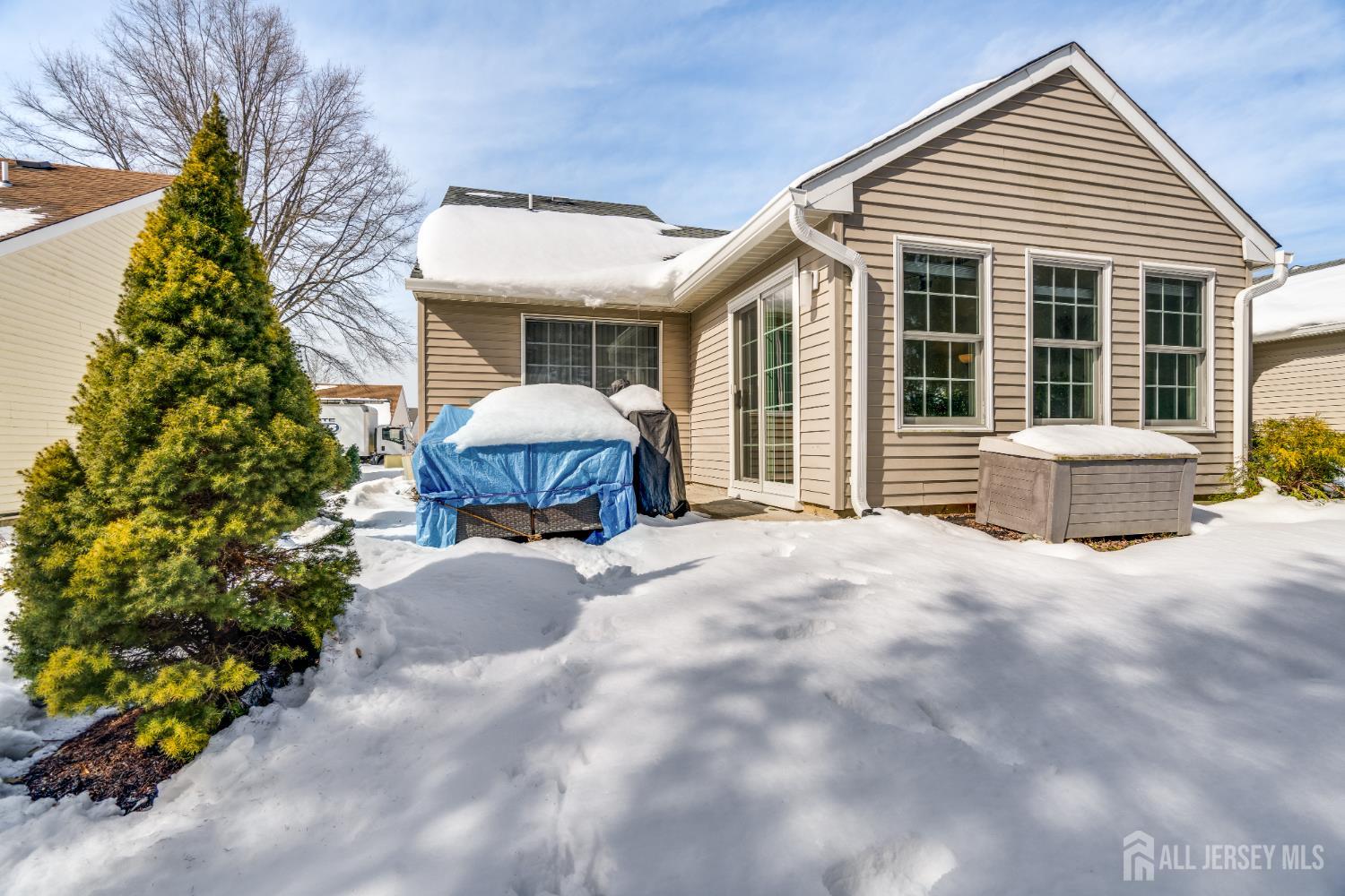 845 B Taylor Road Monroe Township, NJ 08831 - Photo 14 of 15 a front view of a house with a yard and potted plants