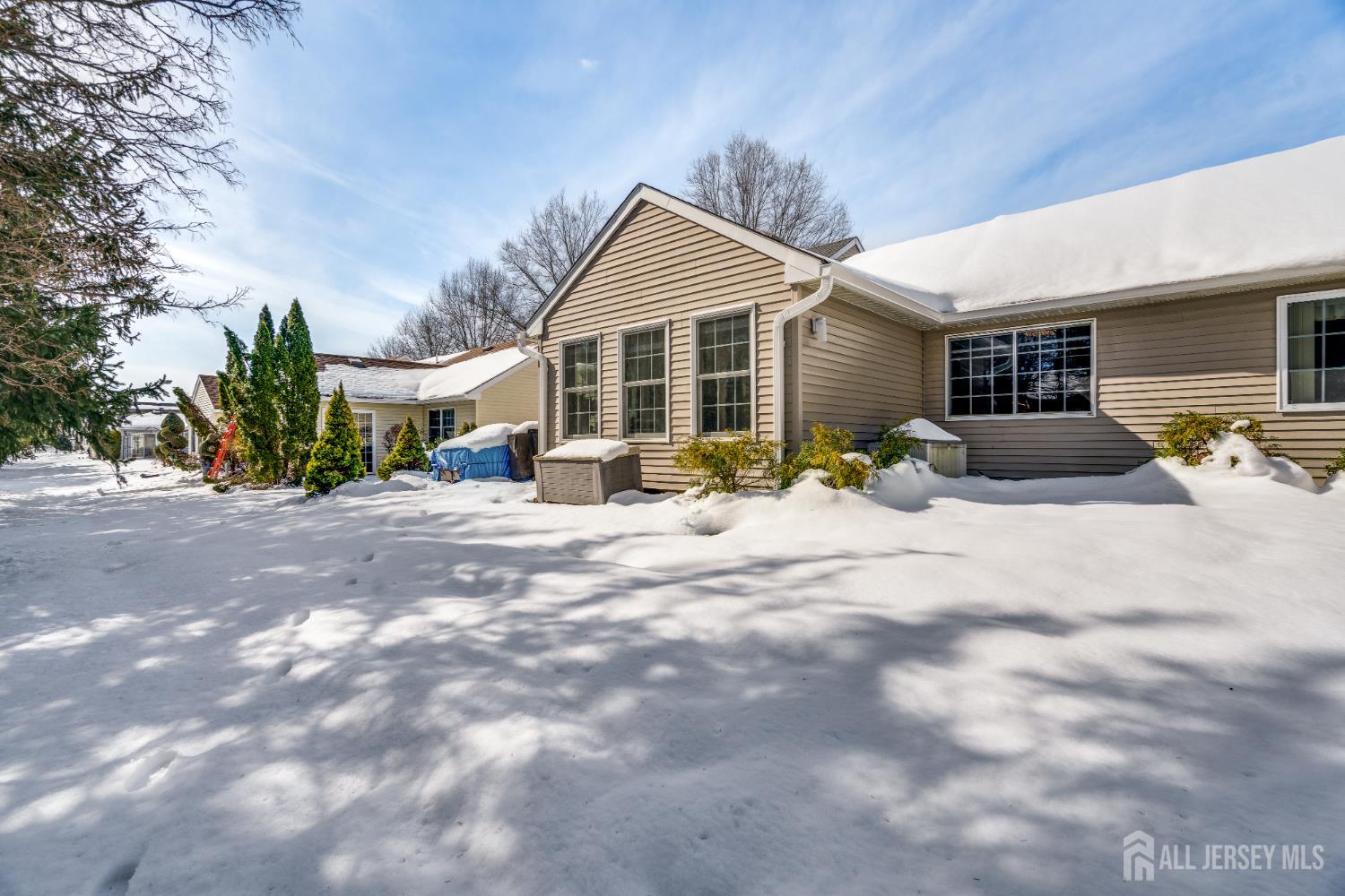 845 B Taylor Road Monroe Township, NJ 08831 - Photo 15 of 15 a view of a house with a yard covered in snow