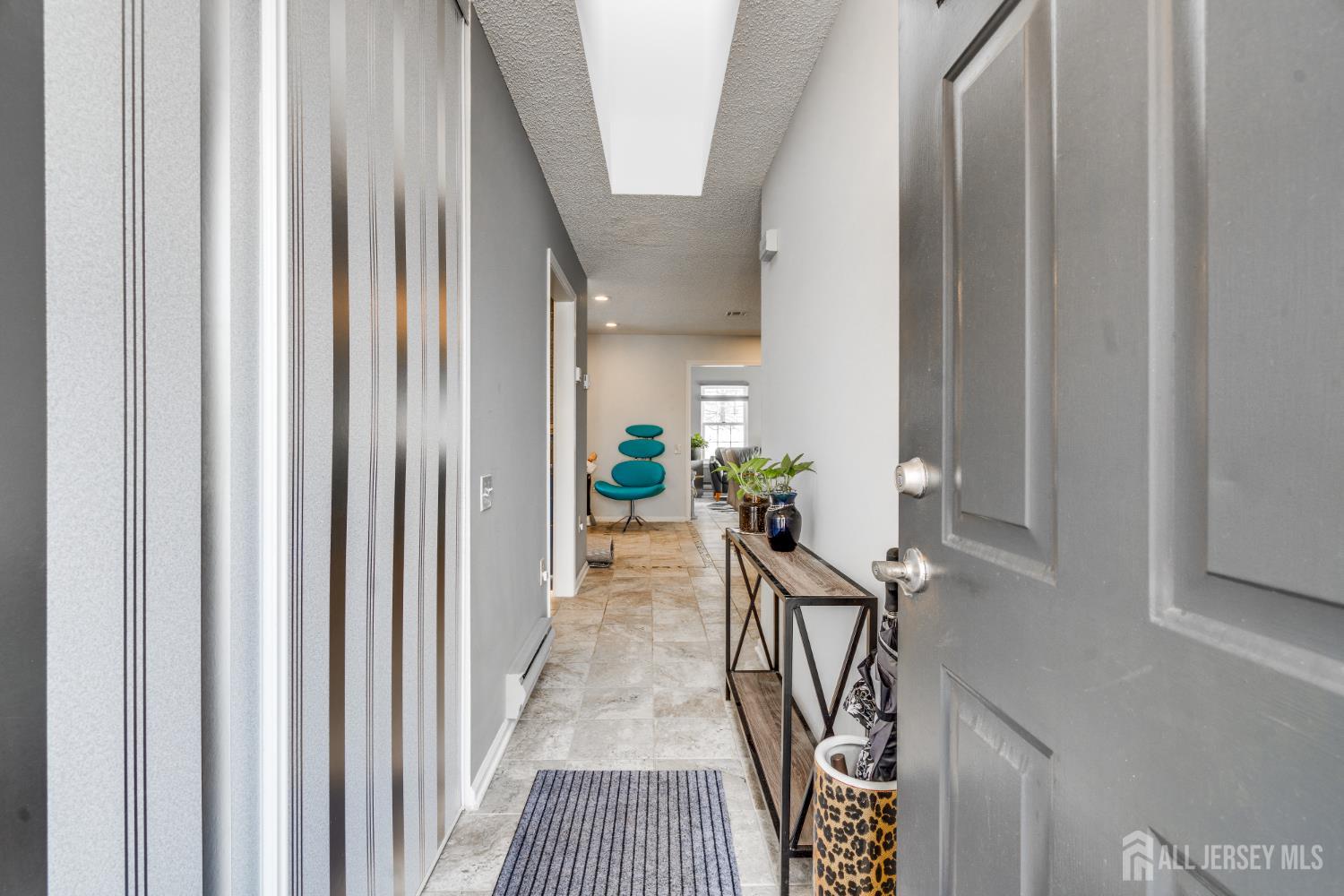 845 B Taylor Road Monroe Township, NJ 08831 - Photo 4 of 15 a view of a hallway with wooden floor and staircase