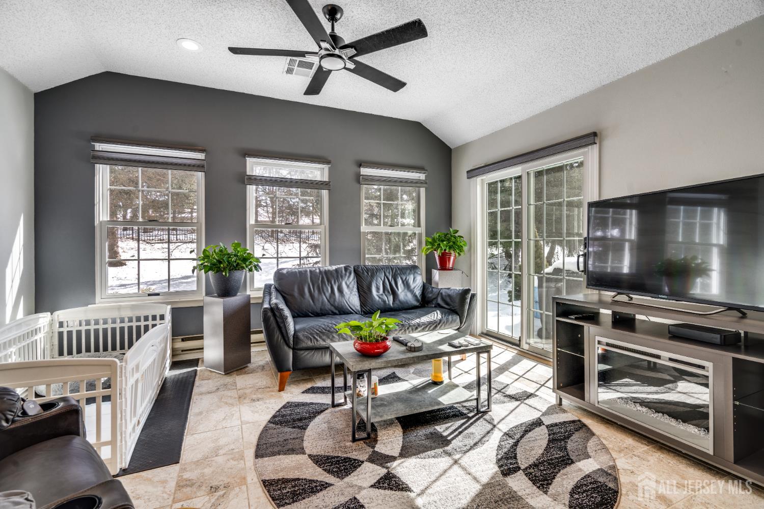 845 B Taylor Road Monroe Township, NJ 08831 - Photo 6 of 15 a living room with furniture and a flat screen tv