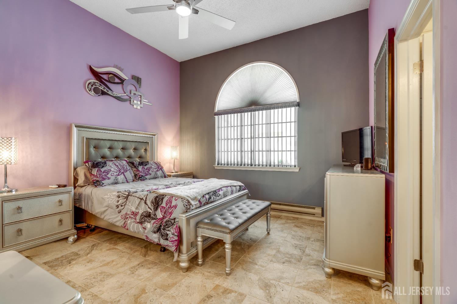 845 B Taylor Road Monroe Township, NJ 08831 - Photo 10 of 15 a bedroom with a bed and a chandelier