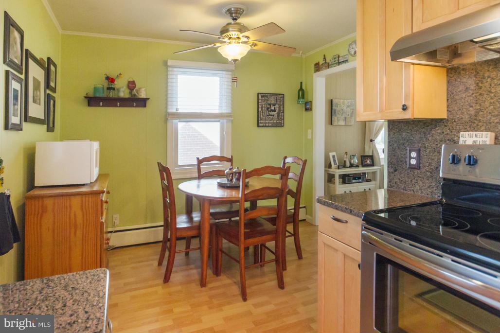 940 Olmstead Road Baltimore, MD 21208 - Photo 14 of 30 Kitchen w/ss appliances opens to breakfast room