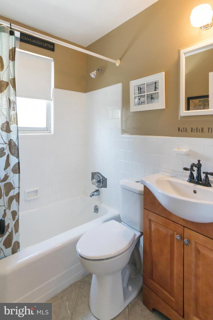 940 Olmstead Road Baltimore, MD 21208 - Photo 5 of 30 Completely updated bathroom w/tile surround
