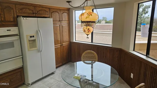 a kitchen with refrigerator and window