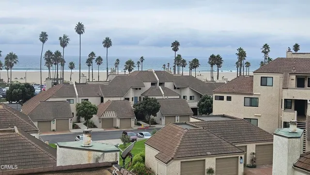 a view of a house with outdoor space and sitting area