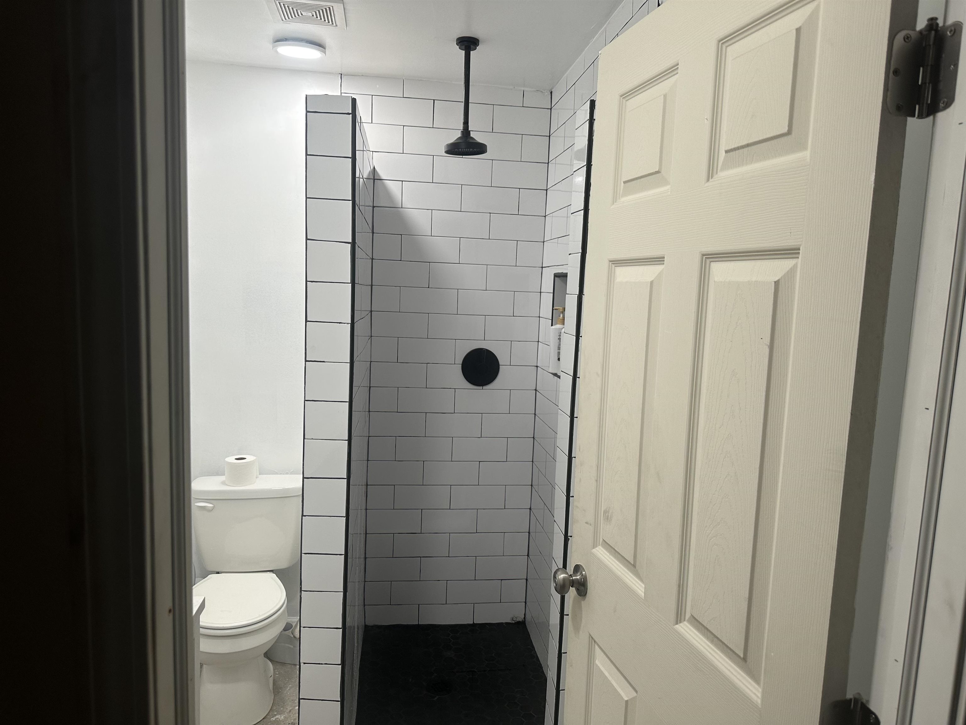 1676 Villa Road Memphis, TN 38108 - Photo 23 of 23 a bathroom with a granite countertop shower and toilet