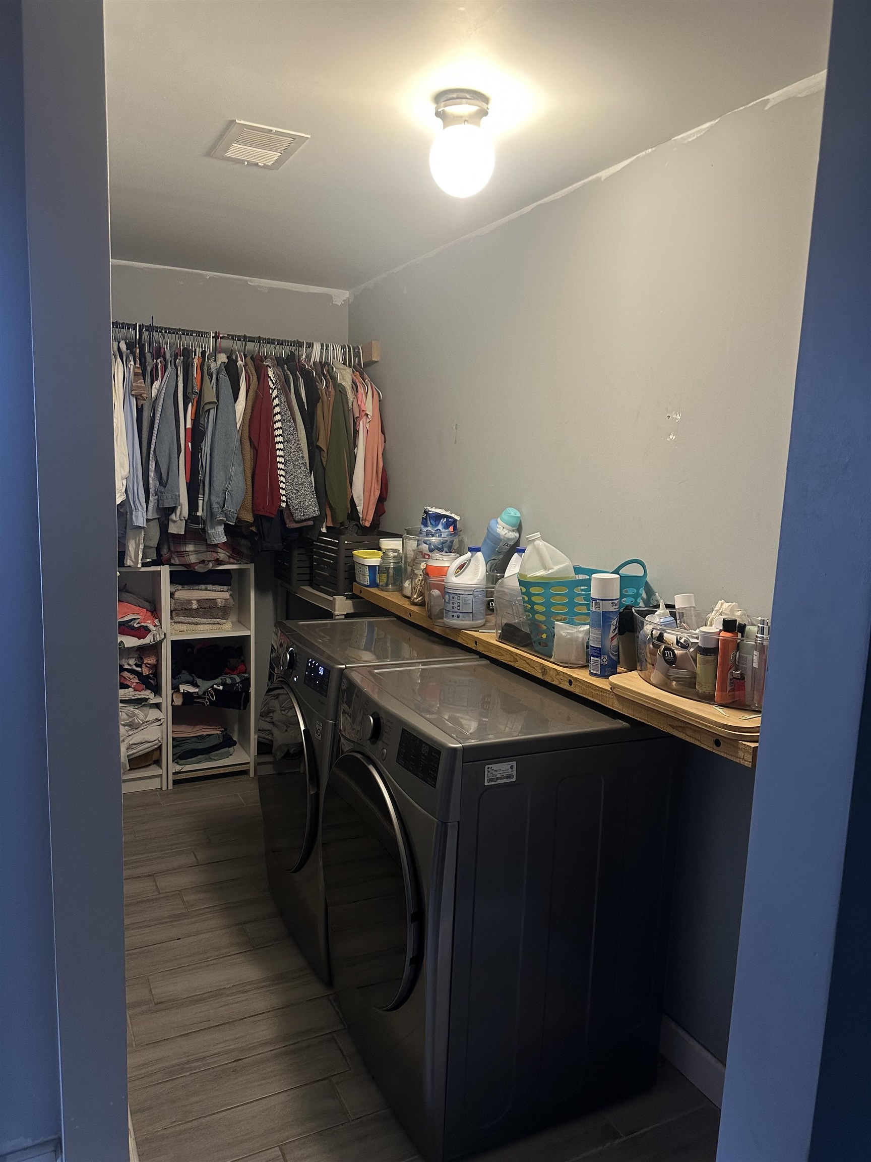 1676 Villa Road Memphis, TN 38108 - Photo 3 of 23 a utility room with cabinets