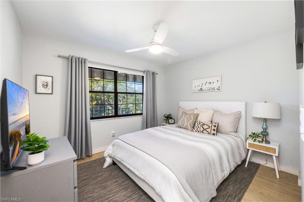 5238 Treetops Drive, Unit L201 Naples, FL 34113 - Photo 20 of 33 a bedroom with bed and a window