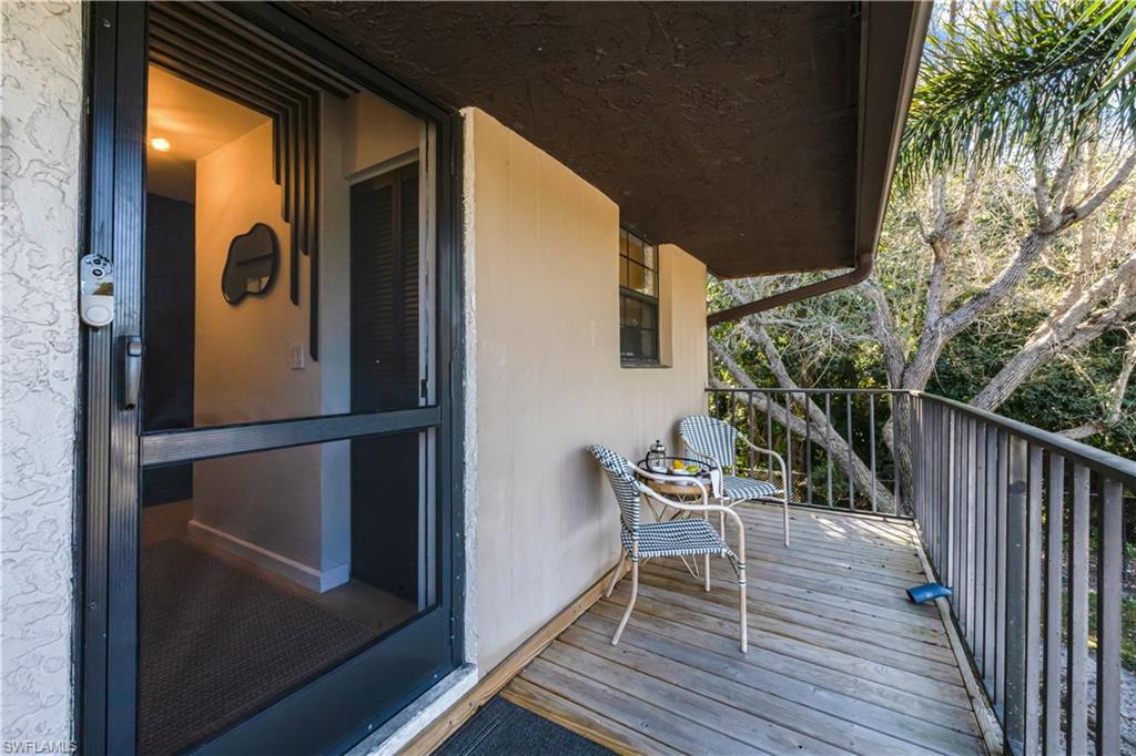 5238 Treetops Drive, Unit L201 Naples, FL 34113 - Photo 28 of 33 a view of deck with patio
