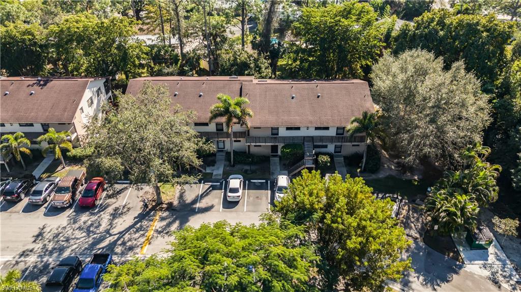 5238 Treetops Drive, Unit L201 Naples, FL 34113 - Photo 30 of 33 an aerial view of a house with a yard
