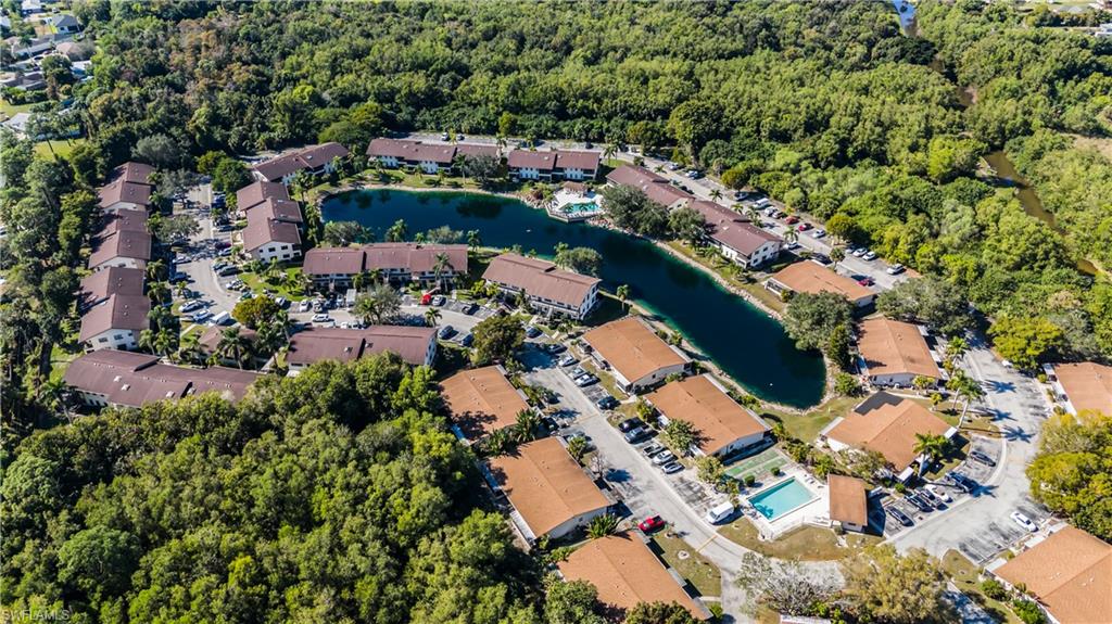 5238 Treetops Drive, Unit L201 Naples, FL 34113 - Photo 34 of 34 an aerial view of house with yard swimming pool and outdoor seating