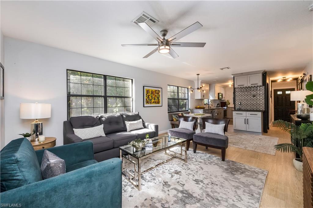 5238 Treetops Drive, Unit L201 Naples, FL 34113 - Photo 6 of 34 a living room with furniture and a window