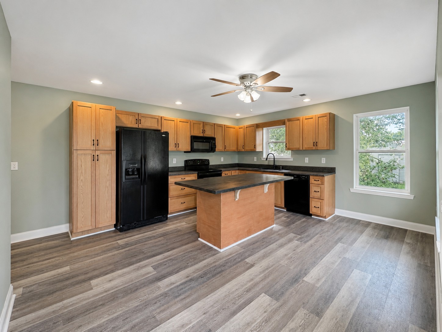 352 Main Street Cerulean, KY 42215 - Photo 7 of 32 a large kitchen with stainless steel appliances granite countertop a stove and a refrigerator