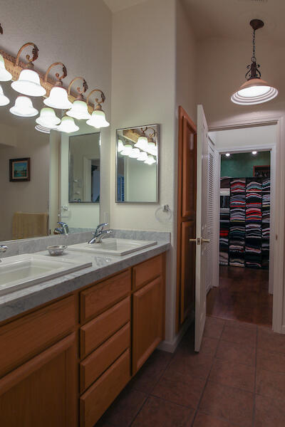 1050 Spring Road Shelter Cove, CA 95589 - Photo 28 of 42 a bathroom with a double vanity sink and a mirror