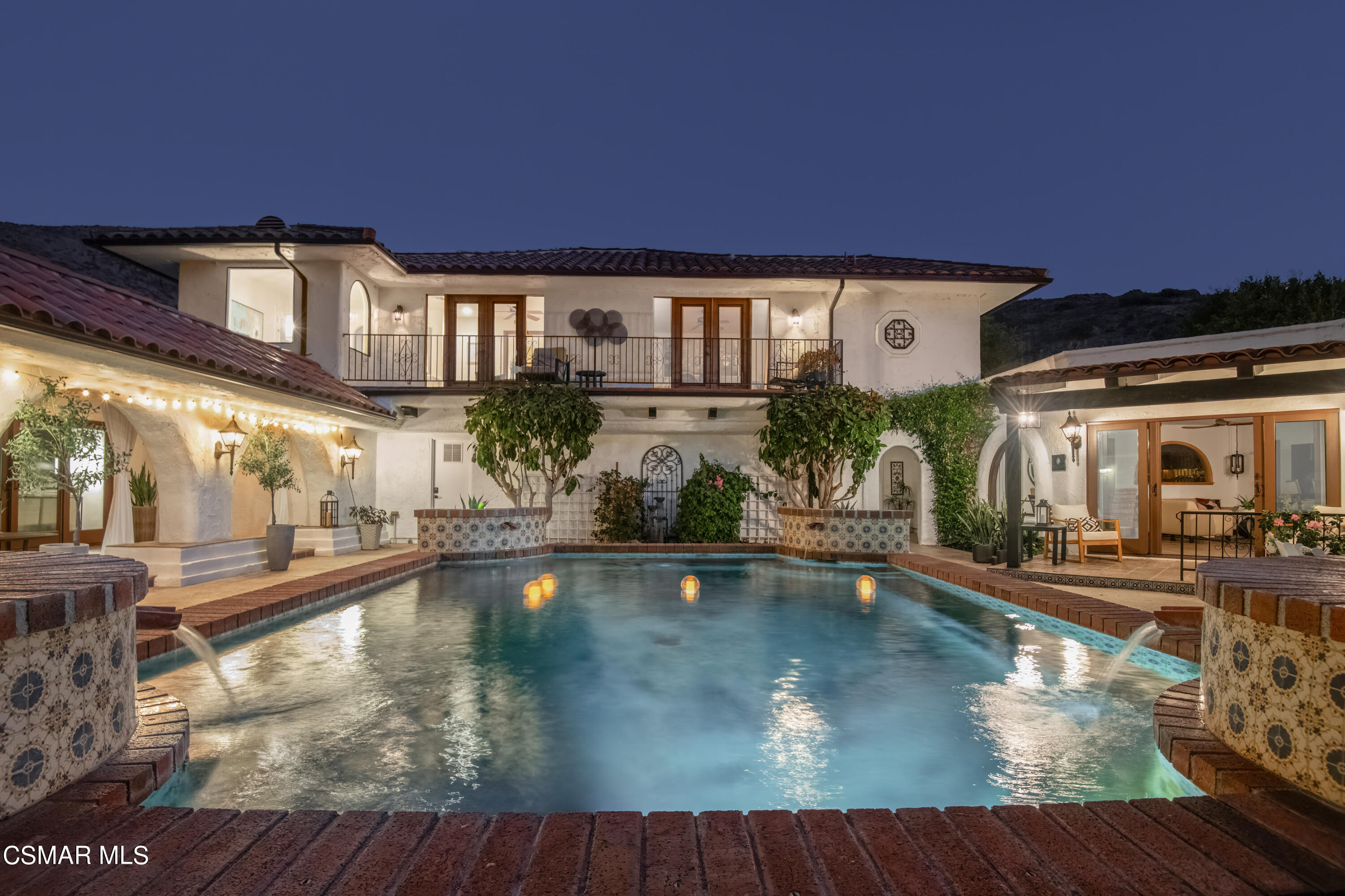 a view of a swimming pool with an outdoor seating