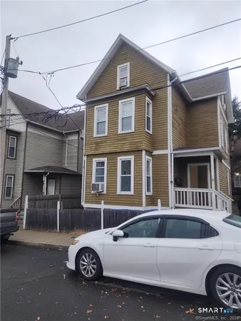 a front view of a house with parking space
