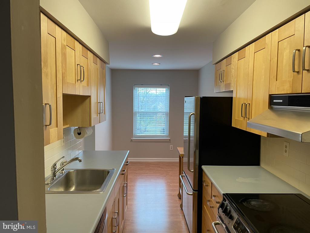 1430 Washington Place Chesterbrook, PA 19087 - Photo 13 of 44 a kitchen with a refrigerator and a sink