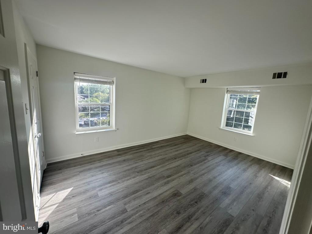 1430 Washington Place Chesterbrook, PA 19087 - Photo 16 of 44 a view of an empty room with wooden floor and a window