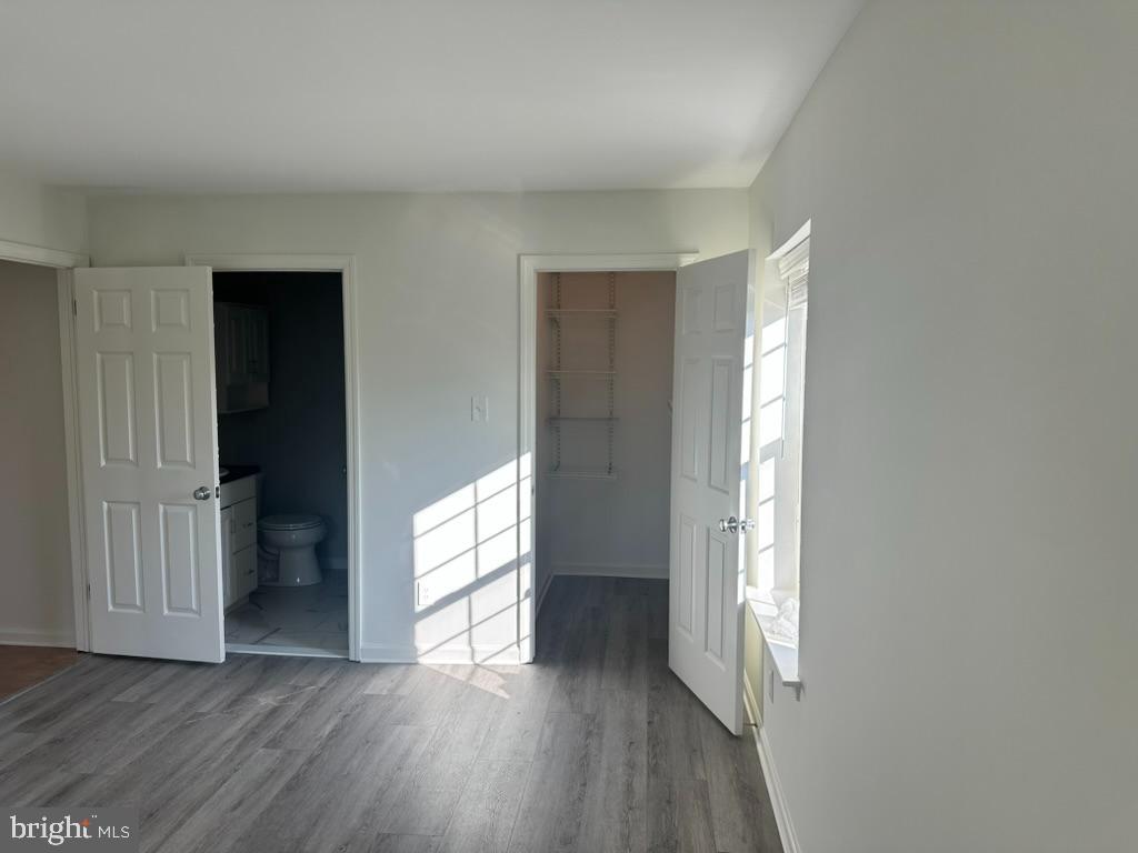 1430 Washington Place Chesterbrook, PA 19087 - Photo 17 of 44 an empty room with wooden floor and windows