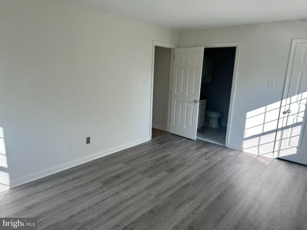 1430 Washington Place Chesterbrook, PA 19087 - Photo 18 of 44 a view of an empty room with wooden floor and a window