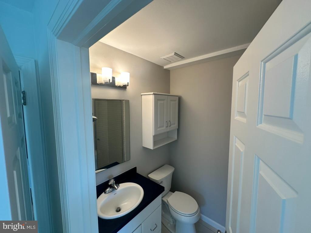 1430 Washington Place Chesterbrook, PA 19087 - Photo 20 of 44 a bathroom with a toilet a sink and mirror