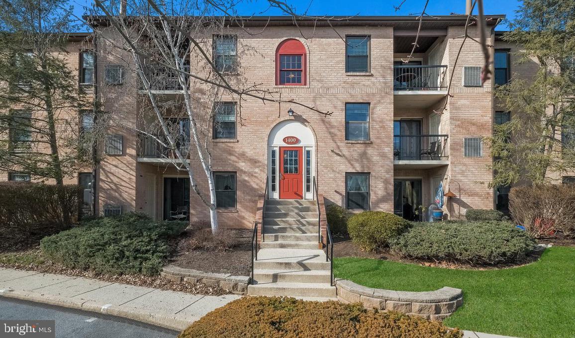 1430 Washington Place Chesterbrook, PA 19087 - Photo 2 of 44 a front view of a house with garden