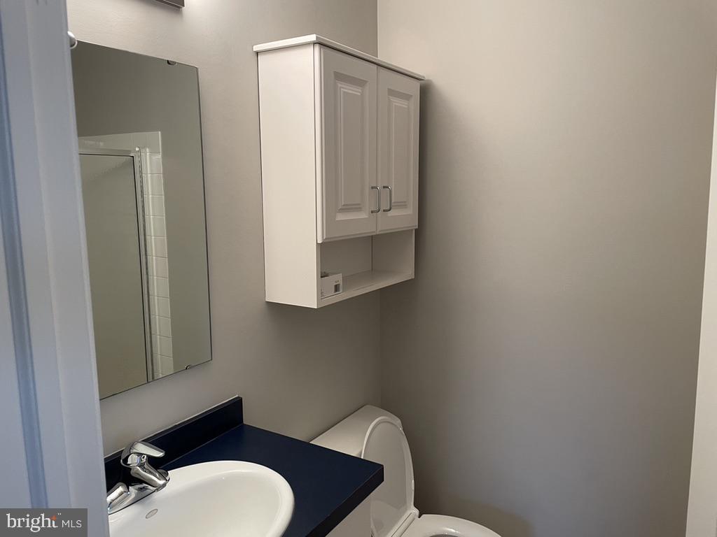 1430 Washington Place Chesterbrook, PA 19087 - Photo 22 of 44 a bathroom with a toilet mirror vanity and toilet