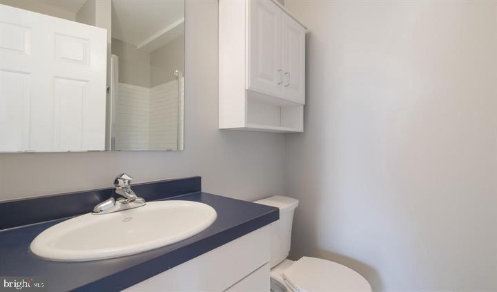1430 Washington Place Chesterbrook, PA 19087 - Photo 23 of 44 a bathroom with a toilet a sink and mirror