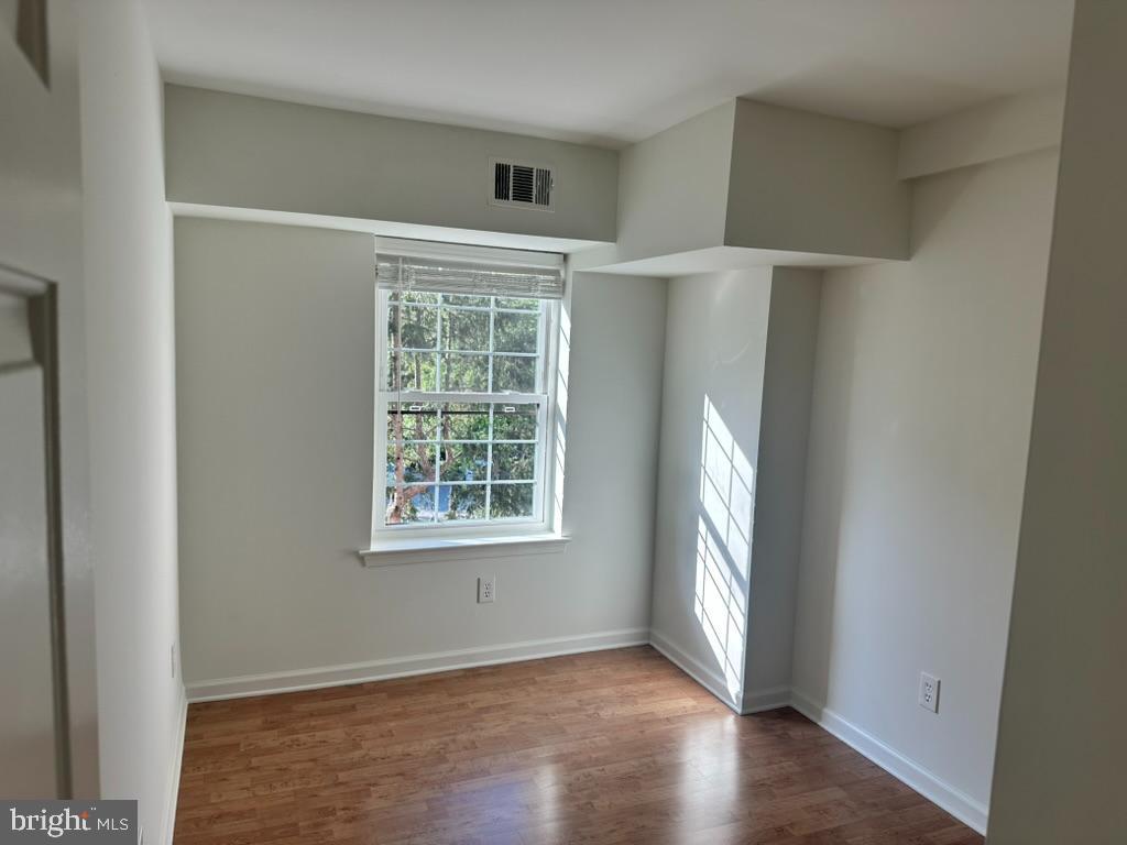 1430 Washington Place Chesterbrook, PA 19087 - Photo 25 of 44 an empty room with wooden floor and windows